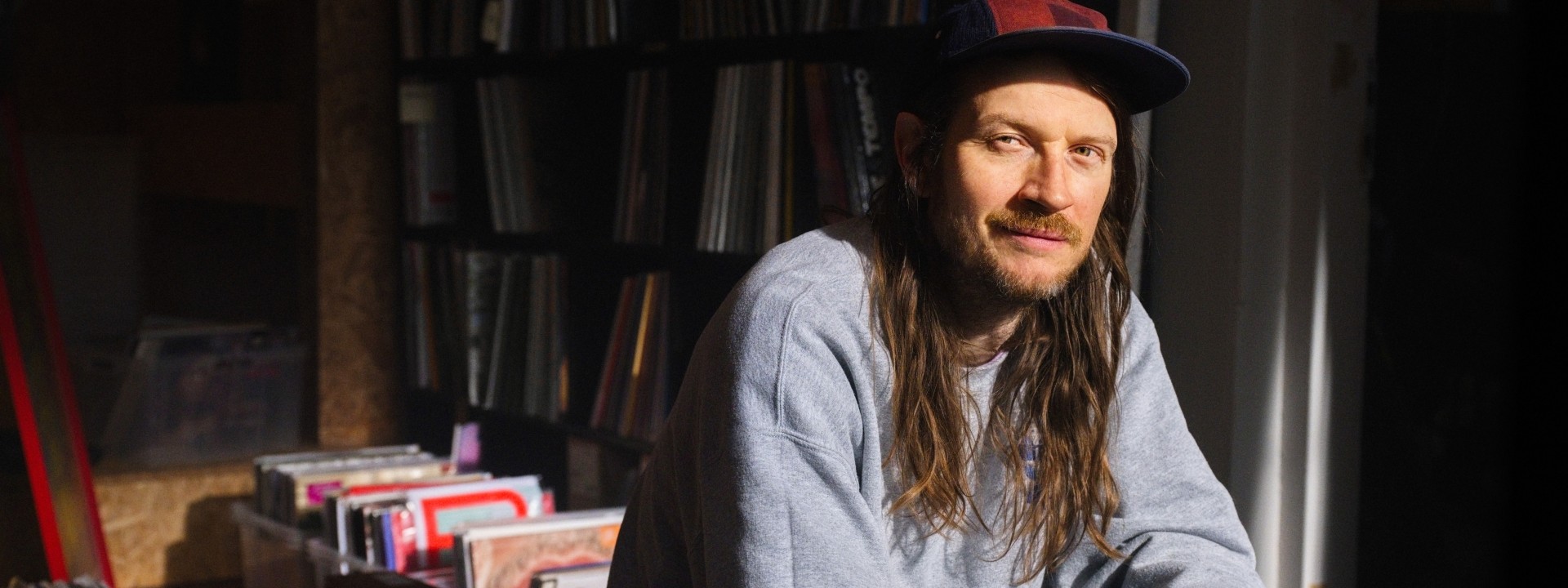 Man in room of vinyl records