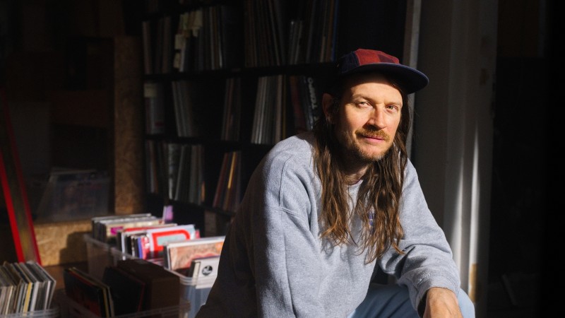 Man in a room of records